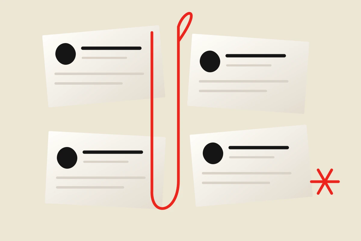 Four paper dossiers connected by a red paper clip, illustrating organized documentation.
