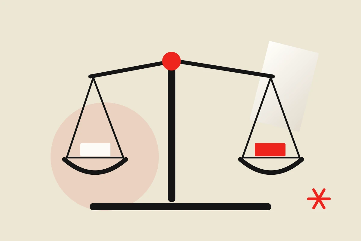 A balanced scale with two sets of cards, illustrating comparison under equal conditions.
